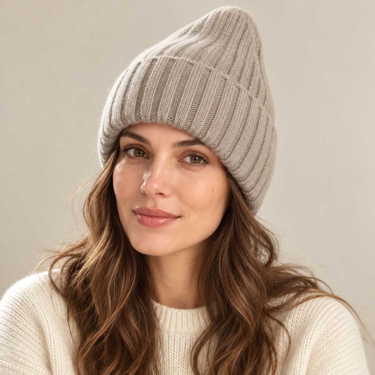 Woman wearing a mocha satin-lined ribbed beanie